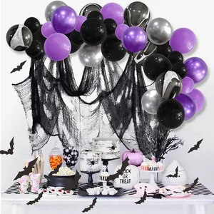 Halloween party decoration kit with purple black balloons, bat stickers, and mesh backdrop