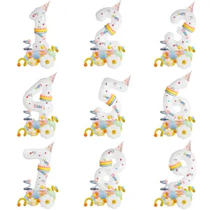 Detail showing cream white number balloons with daisy base and colorful party hats