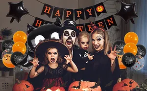 Detail of Happy Halloween banner, bat stickers, and themed latex balloons for party decor