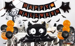 Detail of Halloween party set with bat foil balloon, starry accents and orange latex balloons