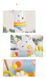 Detailed view of large white number 1 balloon with floral accents and macaron party decor