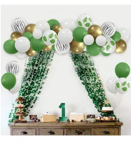 Detail of Wild One party balloons with jungle leaves and gold metallic latex accents
