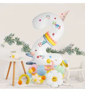 Detail of a birthday decoration set with a white number 2 balloon and a daisy topper