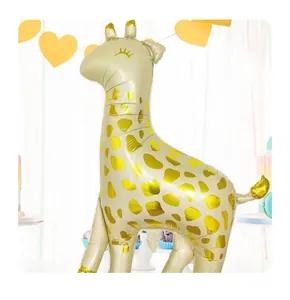 Detail of a giraffe foil balloon with golden spots for birthday party decorations