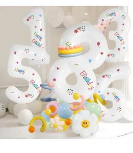 Detail of 40-inch white number balloon kit with daisy and macaron latex decorations