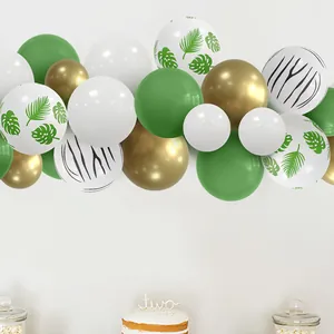 Jungle theme balloon arch kit with tropical leaves, gold and green latex balloons