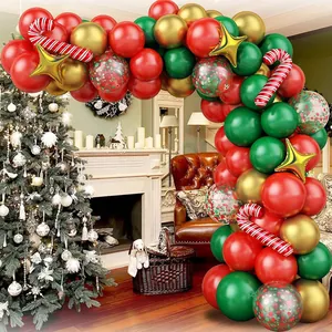 Detail view of a Christmas balloon arch with candy cane and gold star foil balloons