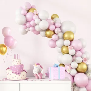 Macaron pink and gold balloon arch kit with floral accents for wedding party decor