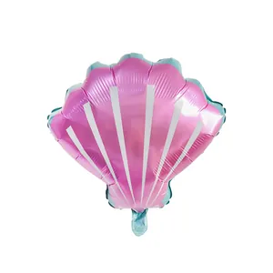 Detailed view of shell-shaped foil balloon in pink and blue for mermaid themed parties