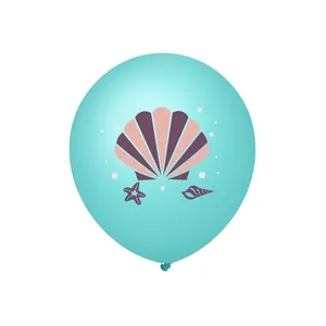 Close-up of mint green latex balloon with purple seashell and starfish pattern