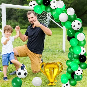Soccer party balloon arch with green and white latex and golden champion trophy balloon