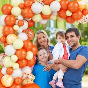Orange and white balloon arch kit with confetti balloons for outdoor family party decor