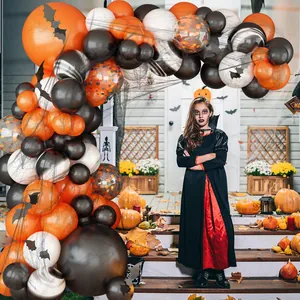 Halloween balloon arch kit with orange and black latex balloons and spider web decoration