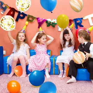 Kids celebrating with macaron balloons and a colorful Happy Birthday banner set