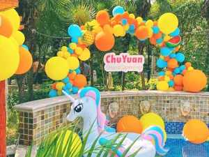 Tropical Hawaiian balloon arch kit with pineapple and watermelon foil balloons for parties