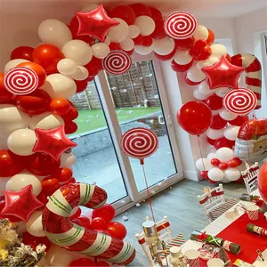 Detail of Christmas balloon arch with candy cane and Santa shapes for party decor