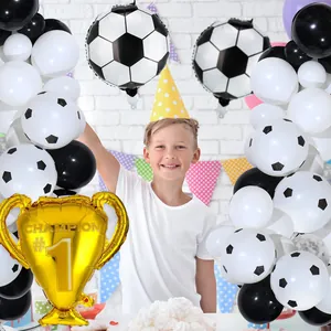 Detail of world cup trophy foil balloon and soccer latex balloons for party decoration