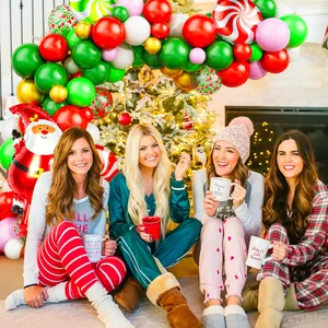 Christmas balloon arch kit with Santa foil balloon and candy cane patterns for party decor