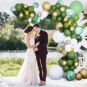 Sage green and gold balloon arch kit with white marble balloons and palm leaves
