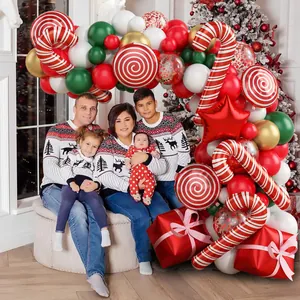 Detail of Christmas balloon arch with candy cane and star foils for festive party decor