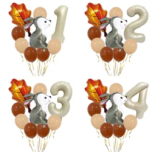 Detail of forest bunny party set with cream number balloon and autumn leaf decor
