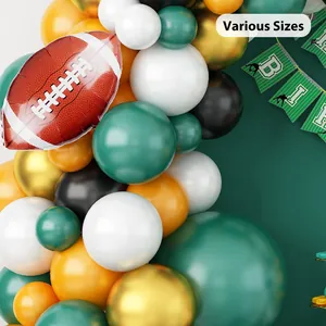Football party balloon arch kit with green latex balloons and brown foil rugby ball