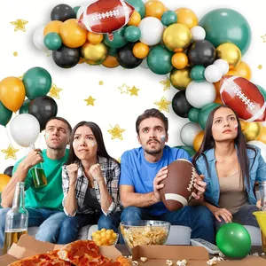Super Bowl football party balloon arch set with gold and green latex and foil football balloons