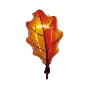 Detail of autumn oak leaf foil balloon with realistic red and orange gradient texture
