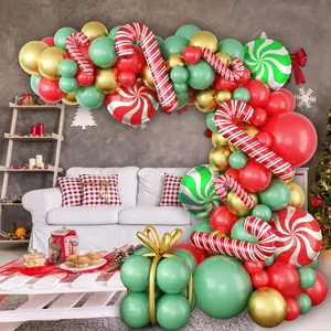 Detailed Christmas balloon arch with candy cane foils and gift box balloon base