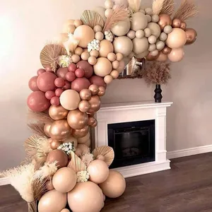 Boho coffee and cream balloon garland kit with palm leaves for birthday party decor