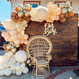 L-shaped balloon arch kit with retro cocoa brown sand and gold balloons for baby shower