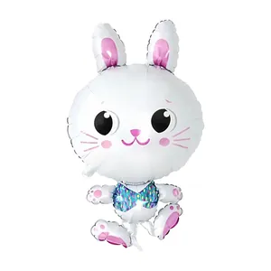 Close-up of cute white rabbit foil balloon with pink accents and rainbow glitter vest detail