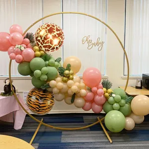 Detail of jungle tiger print 4D balloon arch with Oh Baby sign and palm leaves décor