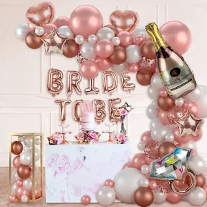 Rose gold bridal shower balloon arch kit with champagne bottle and ring foil balloons