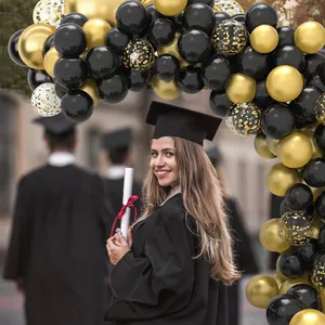Elegant black and gold balloon arch kit with metallic and confetti balloons for graduation
