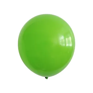 Close-up of a glossy green latex party balloon with a polished reflective surface