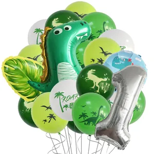 Dinosaur themed first birthday party set with T-Rex balloon and green leaf decorations
