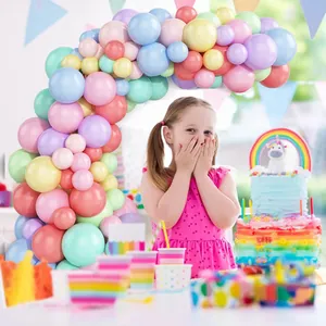 Pastel macaron balloon arch kit for kids birthday parties featuring various colorful sizes