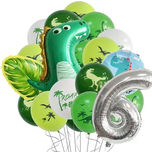 Macro view of dinosaur party kit with green latex balloons and silver number 6 foil balloon
