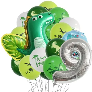 Detailed dinosaur 9th birthday party kit with large foil balloons and tropical leaves