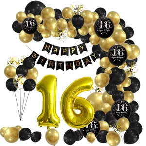 Macro shot of 16th birthday party kit with black and gold balloons and glitter banners
