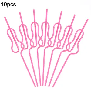 Detail view of 10 pink decorative PET bridal party straws with artistic spiral shapes