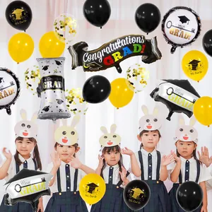 Detail of graduation balloon set with Congratulations GRAD prints and school children props