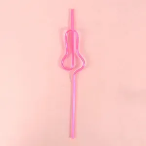 Detailed close-up of a pink plastic novelty straw shaped for bachelorette parties