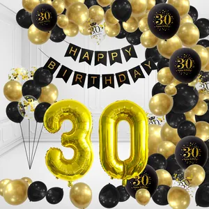 Detail of 30th birthday black and gold balloon arch kit with foil numbers and banner