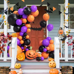 Halloween balloon arch kit with black purple orange latex balloons and pumpkin decor
