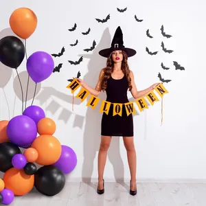 Halloween party garland kit with black lettering banner and colorful festive balloons