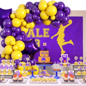 Basketball theme party kit with yellow and purple balloon arch and sports backdrop