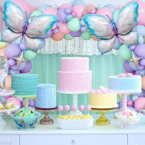 Pastel macaron balloon arch with butterfly and star foil balloons for birthday party decor