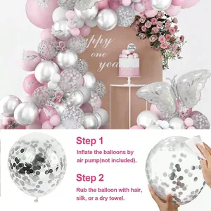 Détail de ballons à paillettes roses et argentées avec papillons 3D pour décoration